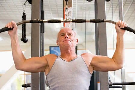 old man lifting weights